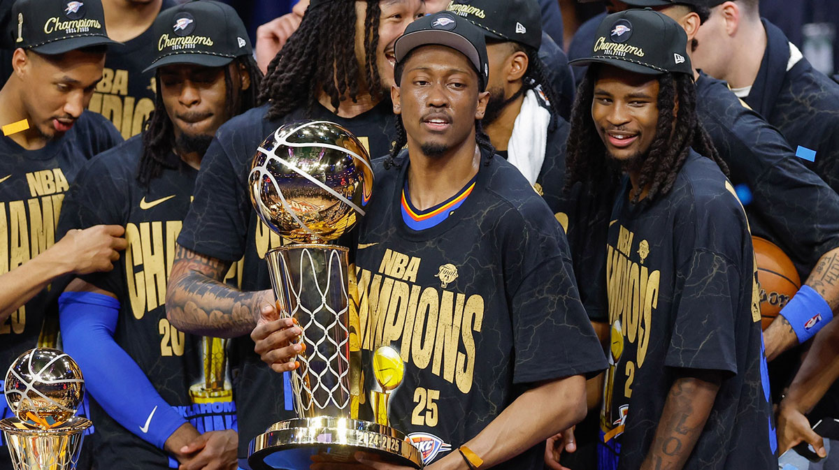 Thunder forward Jalen Williams (8) holds the NBA Larry O'Brien Championship Trophy at the end of game seven of the 2025 NBA Finals after defeating the Indiana Pacers at Paycom Center