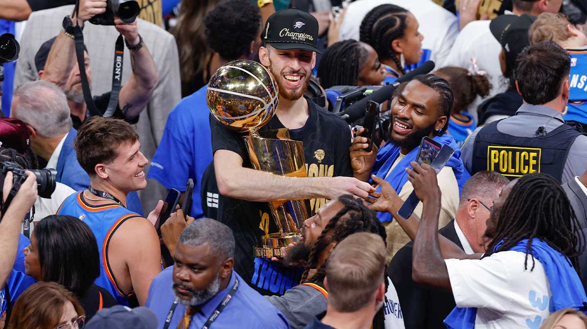 Thunder forward Chet Holmgren (7) celebrates after winning game seven of the 2025 NBA Finals against the Indiana Pacers at Paycom Center with Thunder GM Sam Presti in the background