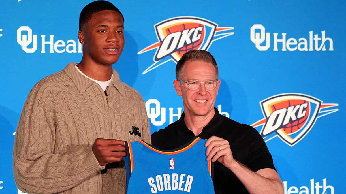 Thunder draft pick Thomas Sorber poses for a photo with general manager Sam Presti during a press conference at the First American's Museum in Oklahoma City, Saturday, June 28, 2025.