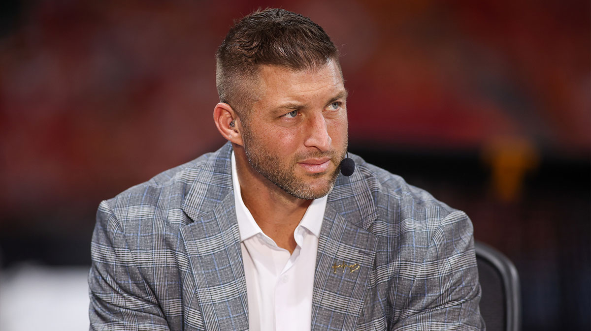 SEC Network analyst Tim Tebow on the field before a game between the Tennessee Volunteers and Syracuse Orange at Mercedes-Benz Stadium.