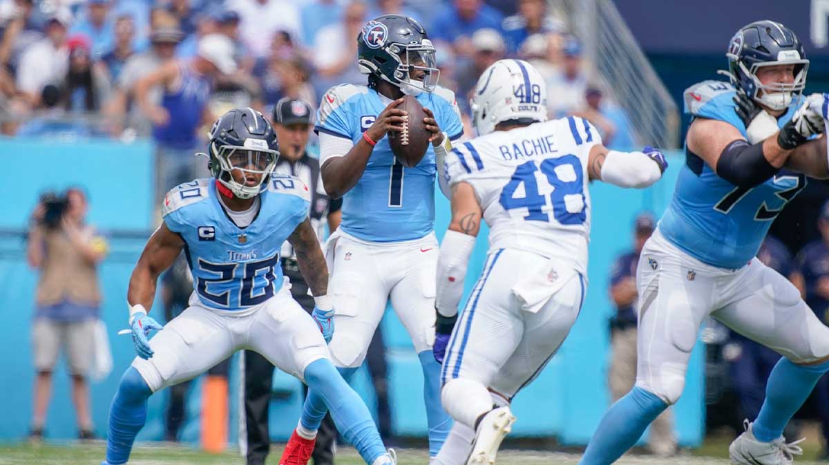 Tennessee Titans quarterback Cam Ward (1) looks for a receiver as Indianapolis Colts linebacker Joe Bachie (48) closes in during the first quarter at Nissan Stadium in Nashville, Tenn., Sunday, Sept. 21, 2025.