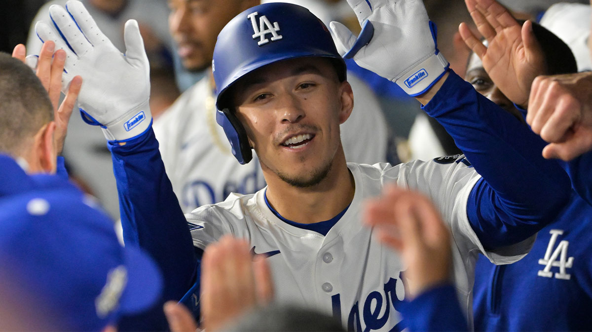 Los Angeles Dodgers second baseman Tommy Edman (25) celebrates after hitting a home run during the third inning against the Cincinnati Reds during game one of the Wildcard round for the 2025 MLB playoffs at Dodger Stadium.