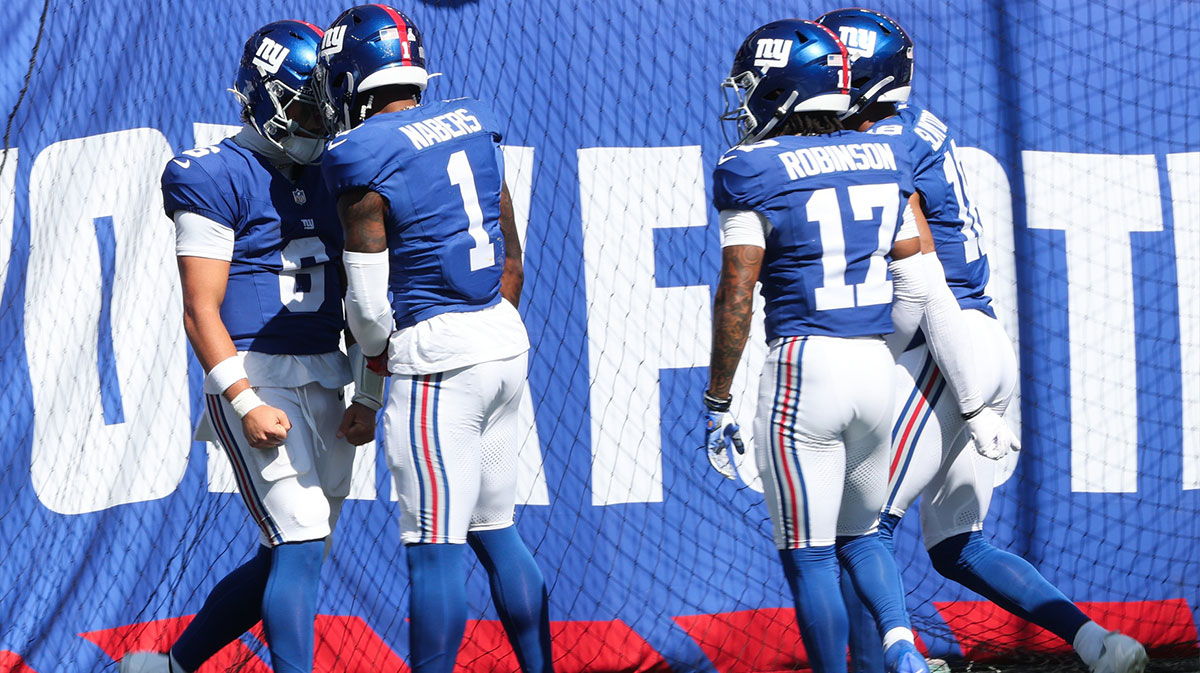 New York Giants quarterback Jaxson Dart (6) celebrates with New York Giants wide receiver Malik Nabers (1) after scoring a touchdown during the first quarter against the Los Angeles Chargers