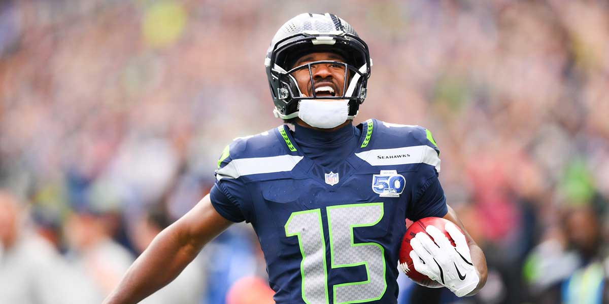 Seattle Seahawks wide receiver Tory Horton (15) makes a 95 yard punt return for a touchdown during the first quarter against the New Orleans Saints at Lumen Field.