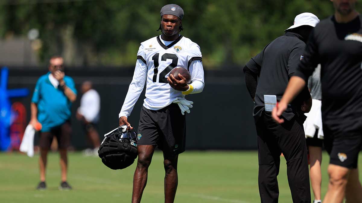 Jacksonville Jaguars wide receiver Travis Hunter (12) looks on during an NFL training camp session at the Miller Electric Center, Friday Aug. 15, 2025 in Jacksonville, Fla.