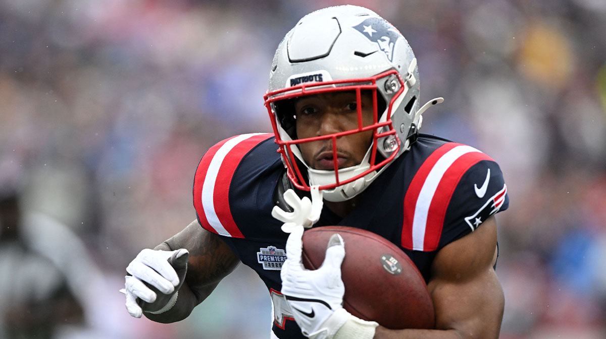 New England Patriots running back TreVeyon Henderson (32) ruswhes the ball against the Las Vegas Raiders in the first half at Gillette Stadium.