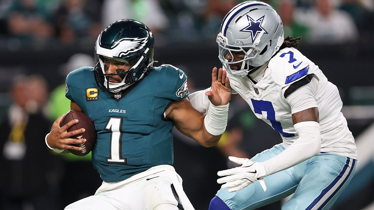 Dallas Cowboys cornerback Trevon Diggs (7) tackles Philadelphia Eagles quarterback Jalen Hurts (1) during the third quarter of the game at Lincoln Financial Field.