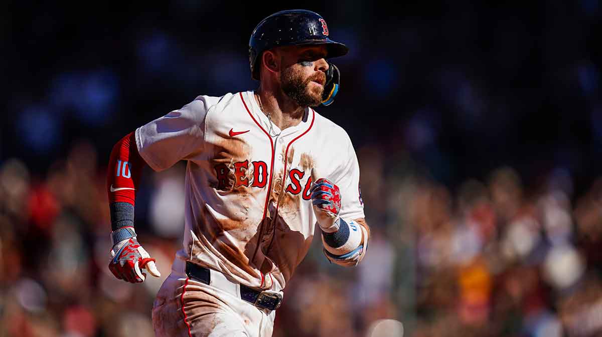 Boston Red Sox shortstop Trevor Story (10) hits a home run against the Athletics in the eighth inning at Fenway Park.