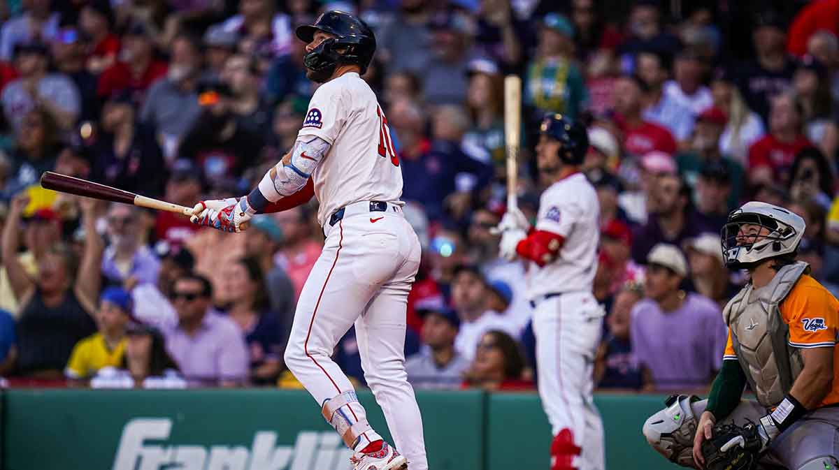 Boston Red Sox shortstop Trevor Story (10) hits a home run against the Athletics in the eighth inning at Fenway Park.
