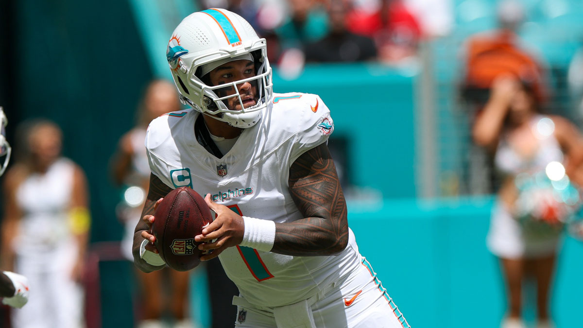 Miami Dolphins quarterback Tua Tagovailoa (1) looks to pass against the New England Patriots in the first quarter at Hard Rock Stadium.