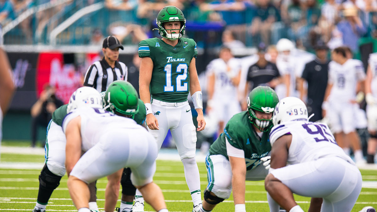 Tulane Green Wave quarterback Jake Ratzlaff (12) looks over the Northwestern Wildcats defense during the first half at Yulman Stadium.