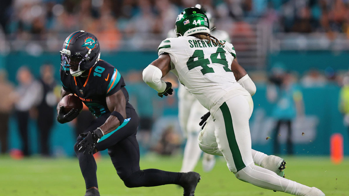 Miami Dolphins wide receiver Tyreek Hill (10) makes a catch and run against New York Jets linebacker Jamien Sherwood (44) during the first half at Hard Rock Stadium.
