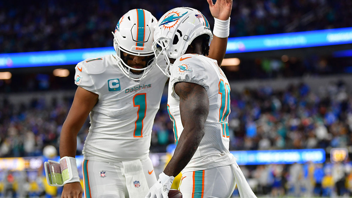 Miami Dolphins wide receiver Tyreek Hill (10) celebrates his touchdown scored against the Los Angeles Chargers with quarterback Tua Tagovailoa (1) during the first half at SoFi Stadium.