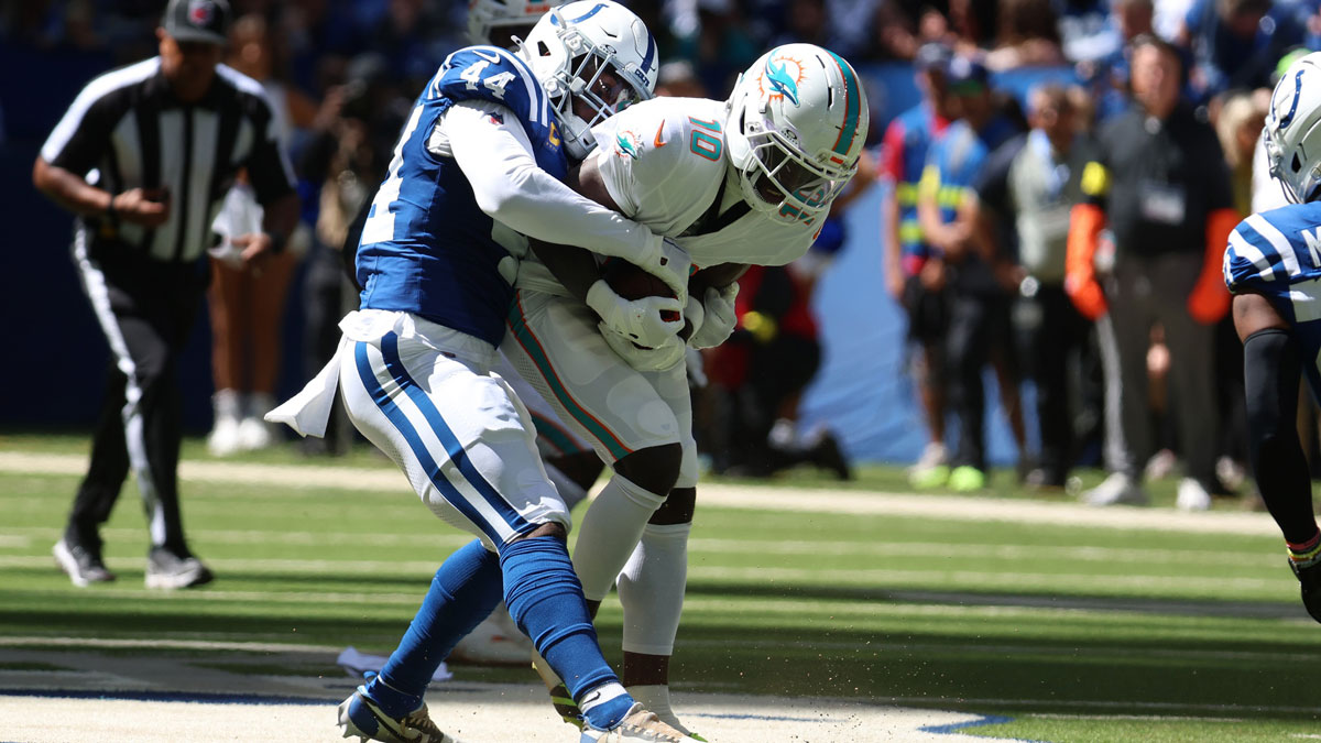 Indianapolis Colts linebacker Zaire Franklin (44) tackles Miami Dolphins wide receiver Tyreek Hill (10) during the first quarter at Lucas Oil Stadium