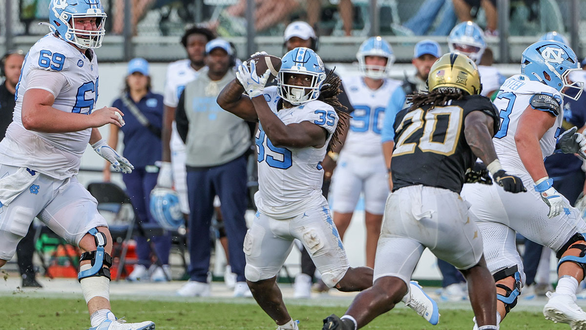 North Carolina Tar Heels running back Demon June (12) catches a pass during the second half against the UCF Knightsat the Bounce House Stadium.