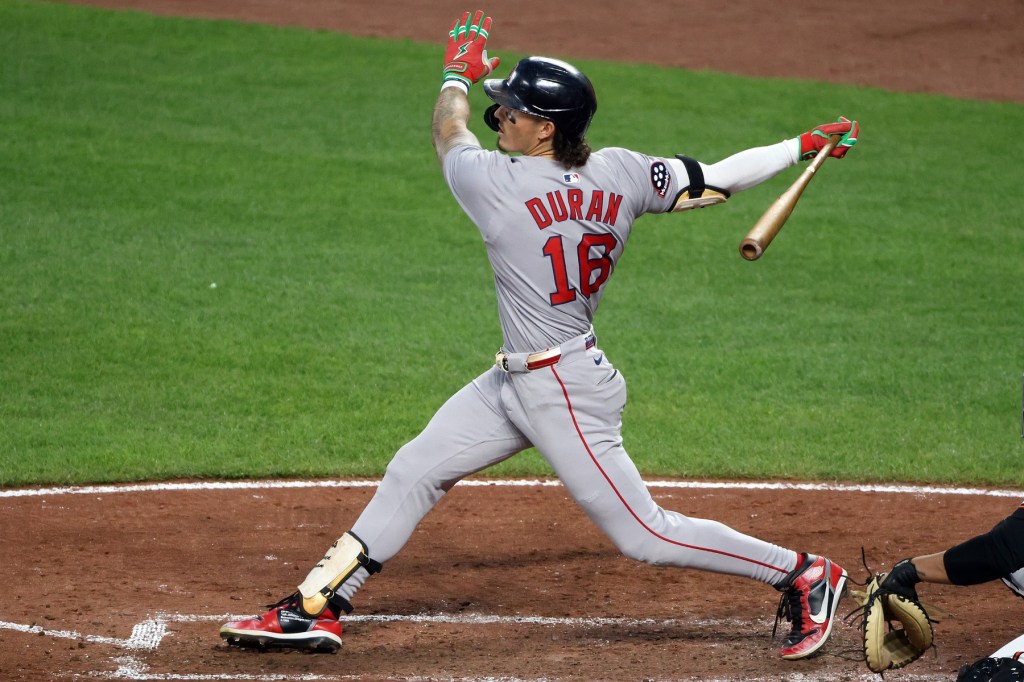 Boston Red Sox outfielder Jarren Duran (16) hits a home run during the fifth inning against the Baltimore Orioles at Oriole Park at Camden Yards.