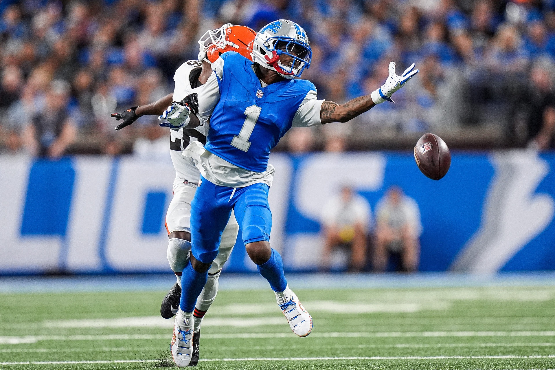 Detroit Lions wide receiver Jameson Williams (1) tries to catch a pass intended for him against Cleveland Browns cornerback Myles Harden (26) during the second half at Ford Field in Detroit on Sunday, Sept. 28, 2025.