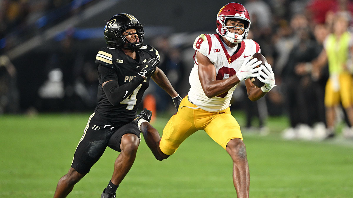 USC Trojans wide receiver Ja'Kobi Lane (8) catches a pass in front of Purdue Boilermakers defensive back Hudauri Hines (4) during the second half at Ross-Ade Stadium.