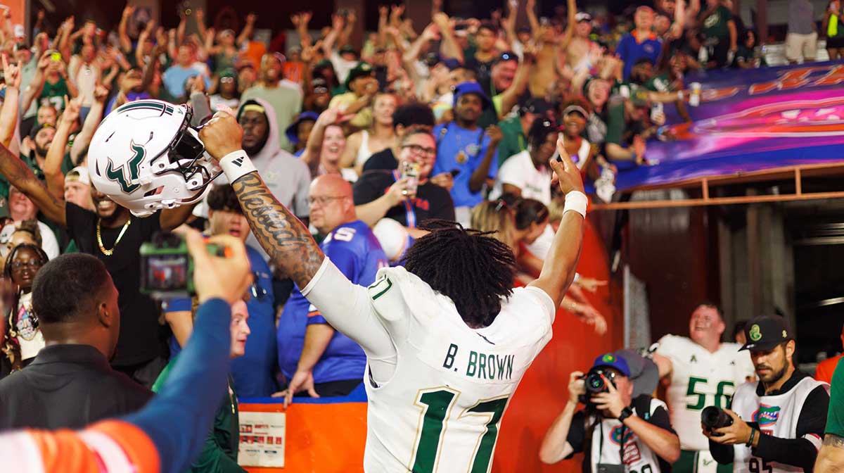 South Florida Bulls quarterback Byrum Brown (17) gestures towards fans after a game against the Florida Gators at Ben Hill Griffin Stadium.