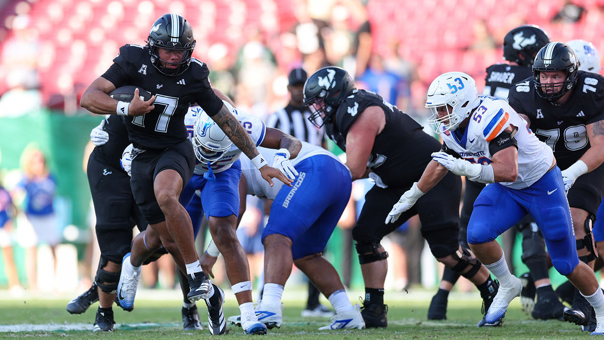 South Florida Bulls quarterback Byrum Brown (17) runs with the ball against the Boise State Broncos in the second quarter at Raymond James Stadium.