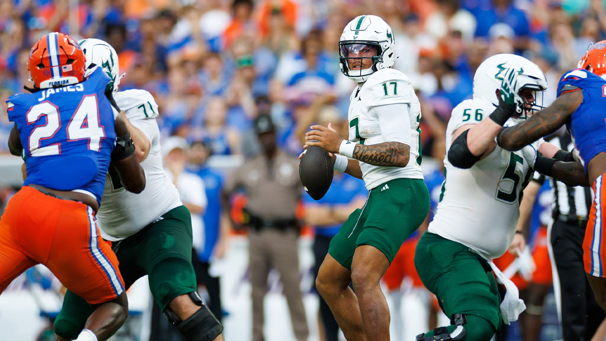 South Florida Bulls quarterback Byrum Brown (17) looks to throw against the Florida Gators during the first half at Ben Hill Griffin Stadium.