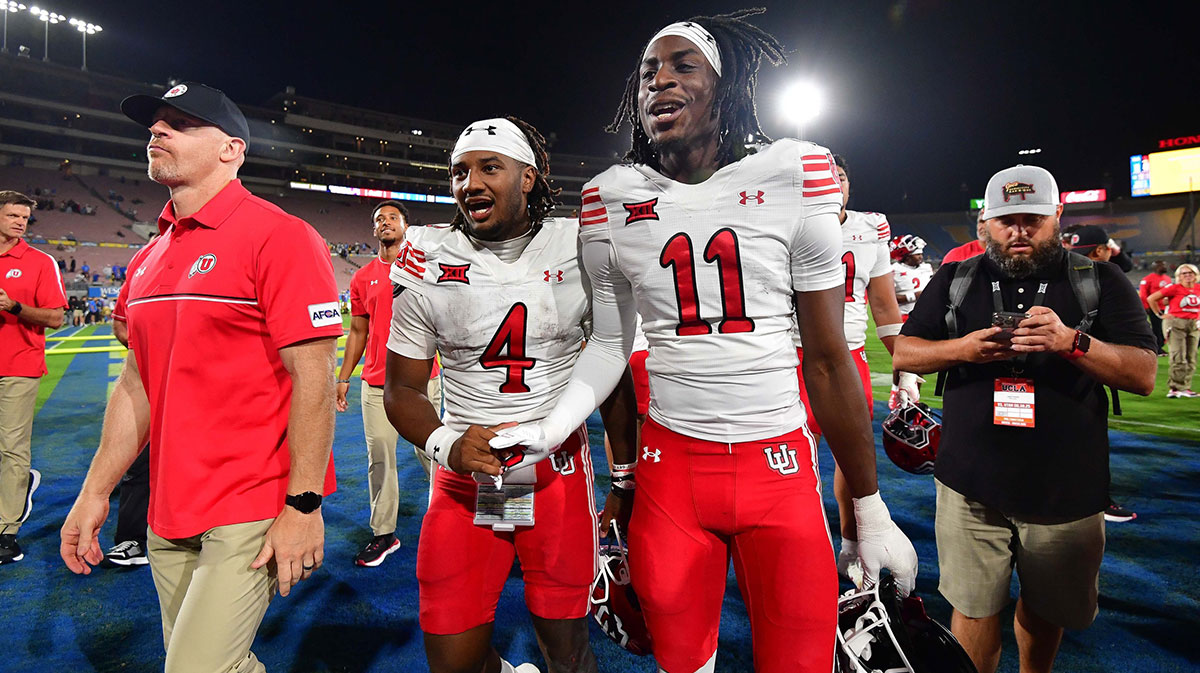 Utah Utes quarterback Devon Dampier (4) and cornerback Rock Caldwell (11) celebrate the victory against the UCLA Bruins at Rose Bowl.