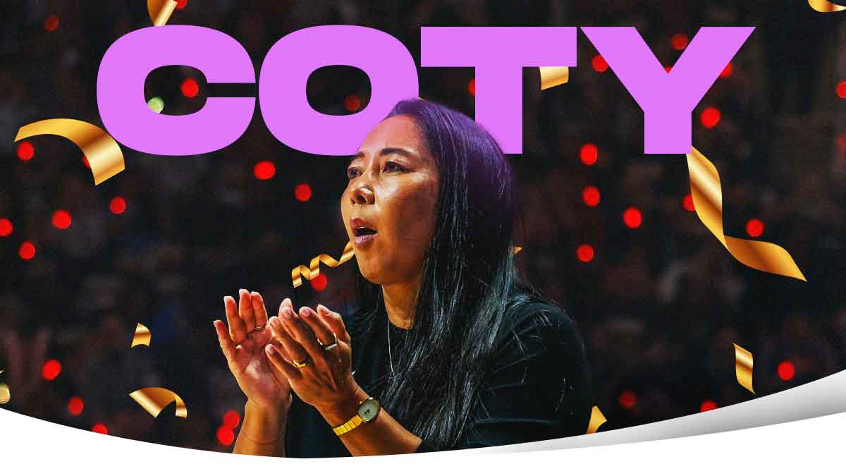 Valkyries' Natalie Nakase is happy with purple and gold confetti raining down around her as the words "COTY" in big light purple text begind her