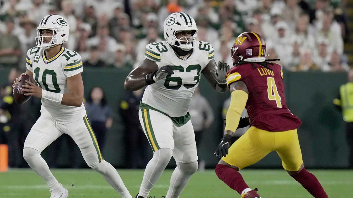 Green Bay Packers offensive tackle Rasheed Walker (63) provides pass protection for quarterback Jordan Love (10) during the first quarter of their game against the Washington Commanders Thursday, September 11, 2025 at Lambeau Field in Green Bay, Wisconsin.