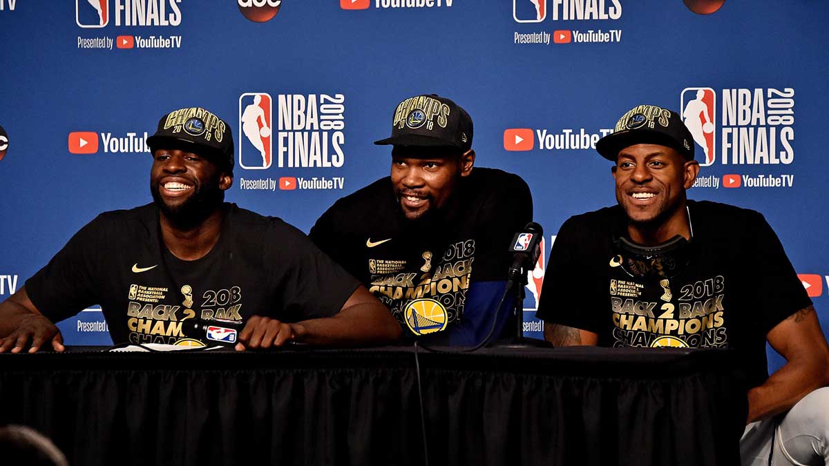 Warriors forward Draymond Green (23), forward Kevin Durant (35) and forward Andre Iguodala (9) speak during a press conference after beating the Cleveland Cavaliers in game four of the 2018 NBA Finals at Quicken Loans Arena