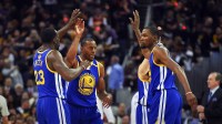 Warriors forward Andre Iguodala (9), Golden State Warriors forward Draymond Green (23) and forward Kevin Durant (35) celebrate during the first quarter against the Cleveland Cavaliers in game three of the 2017 NBA Finals at Quicken Loans Arena