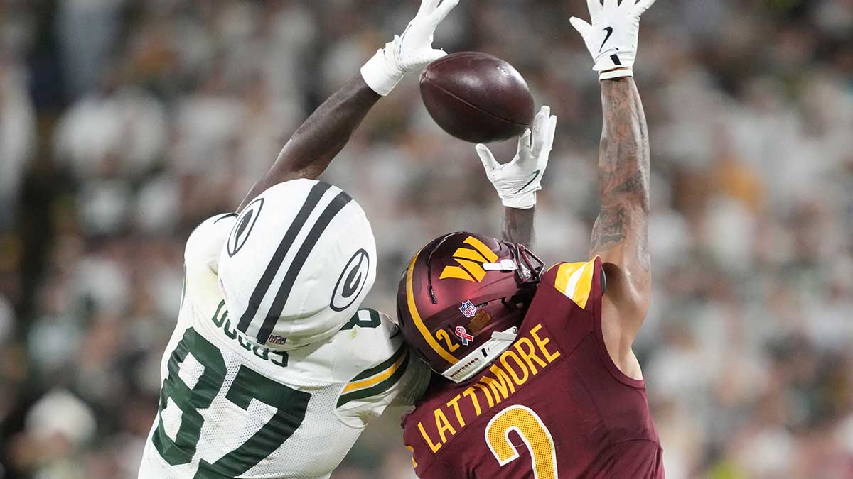 Green Bay Packers wide receiver Romeo Doubs (87) cannot make a catch against Washington Commanders cornerback Marshon Lattimore (2) in the second quarter at Lambeau Field.