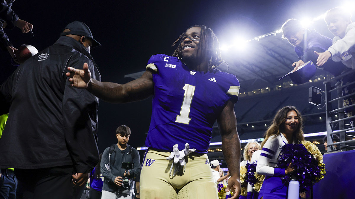 Sep 6, 2025; Seattle, Washington, USA; Washington Huskies running back Jonah Coleman (1) returns to the locker room following a victory against the UC Davis Aggies at Husky Stadium. Mandatory Credit: Joe Nicholson-Imagn Images