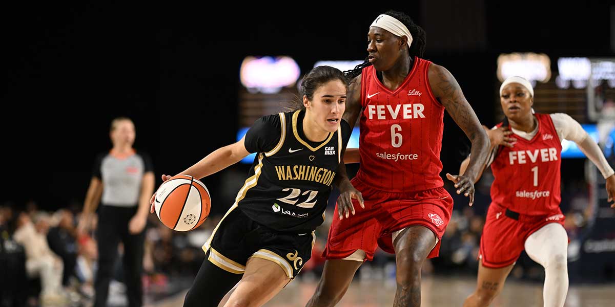 Washington Mystics guard Sonia Citron (22) looks to drive past Indiana Fever forward Natasha Howard (6) during the third quarter at CFG Bank Arena.