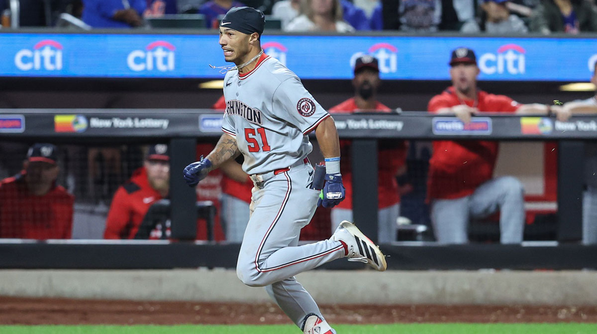 Washington Nationals designated hitter Daylen Lile (51) hits a two run inside the park home run in the eleventh inning against the New York Mets at Citi Field.