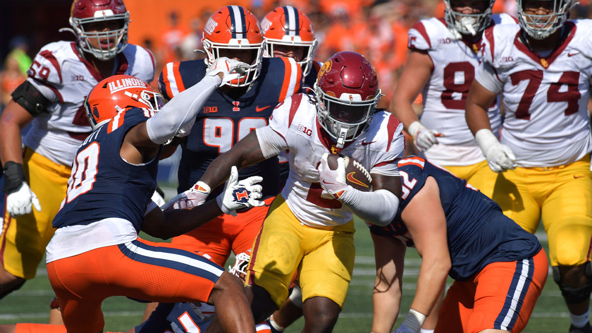 Southern California Trojans running back Waymond Jordan (2) runs through the Illinois Fighting Illini defensive line during the second half at Memorial Stadium. 
