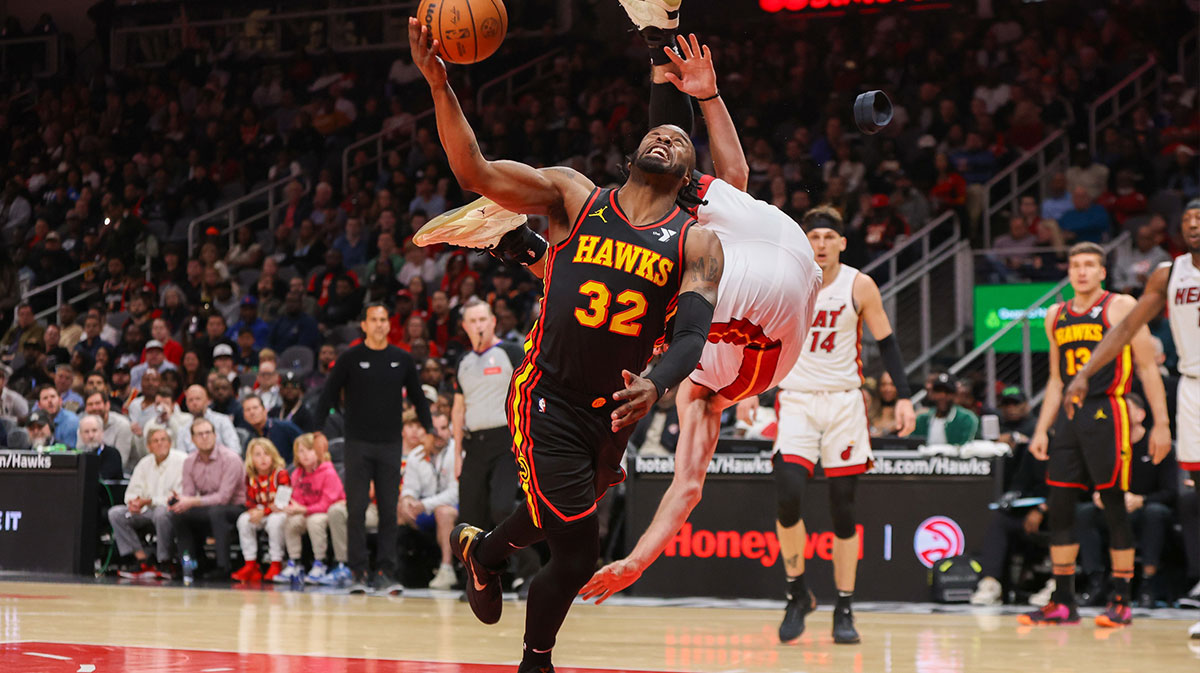 Atlanta Hawks guard Wesley Matthews (32) as Miami Heat forward Nikola Jovic (5) goes over his head in the second half at State Farm Arena.
