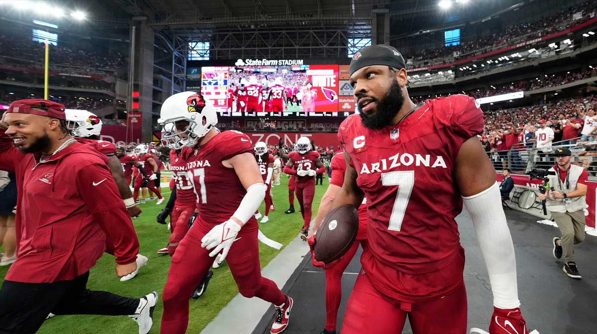 Arizona Cardinals linebacker Kyzir White (7) holds onto the ball after intercepting a Dallas Cowboys pass in the end zone in the second half at State Farm Stadium in Glendale on Sept. 24, 2023.