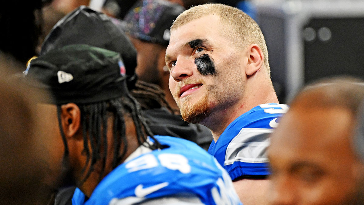 Detroit Lions defensive end Aidan Hutchinson (97) looks on from the bench during the second half against the Cleveland Browns at Ford Field.