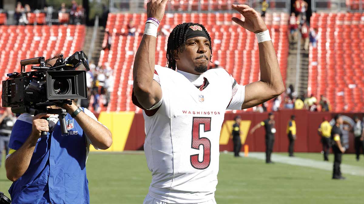 Washington Commanders quarterback Jayden Daniels (5) walks off the field after the game against the New York Giants at Northwest Stadium.