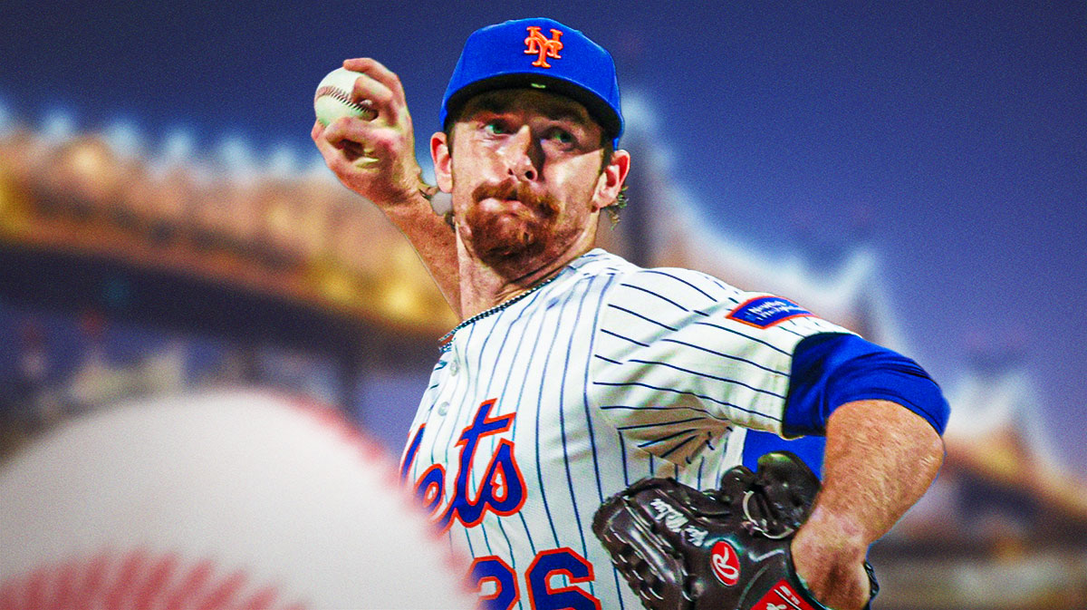 Mets starter Nolan McLean in his home jersey with the Queensboro bridge behind him.