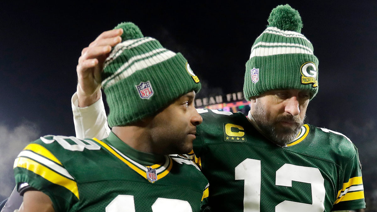 Green Bay Packers quarterback Aaron Rodgers (12) and wide receiver Randall Cobb (18) leave the field after losing to the Detroit Lions 20-16 during their football game on Sunday, January, 8, 2023 at Lambeau Field in Green Bay, Wis.