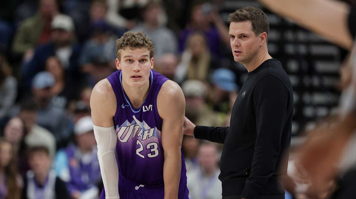 Utah Jazz forward Lauri Markkanen (23) and head coach Will Hardy talk during a stop in play in the second half against the Orlando Magic at Delta Center.