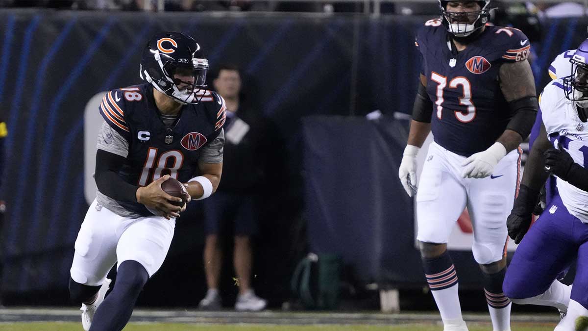 Chicago Bears quarterback Caleb Williams (18) rushes the ball against the Minnesota Vikings during the first half at Soldier Field.