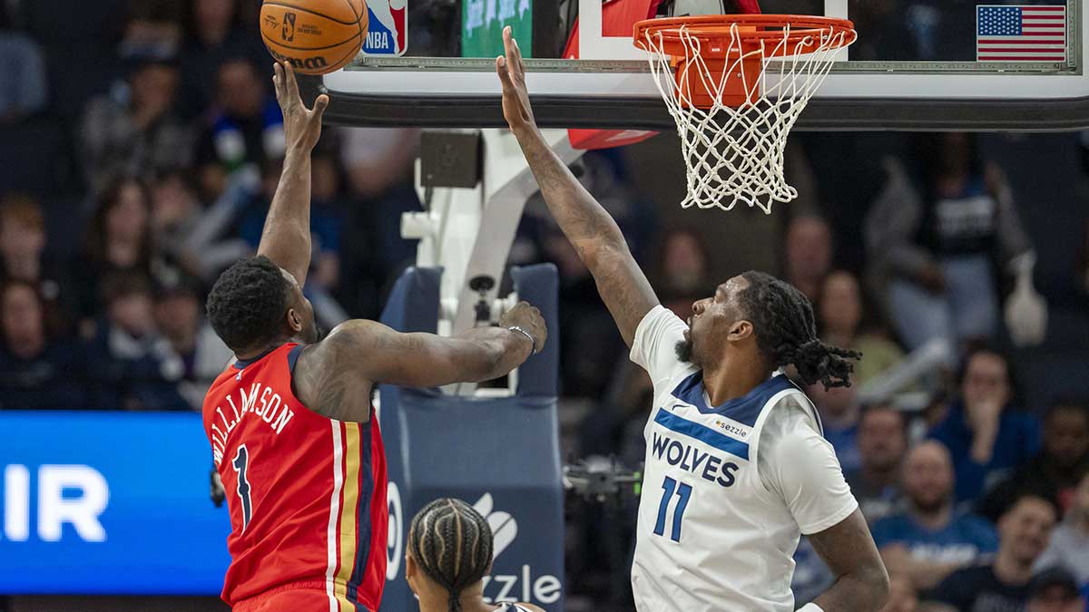 New Orleans Pelicans forward Zion Williamson (1) shoots the ball over Minnesota Timberwolves center Naz Reid (11) in the first half at Target Center.