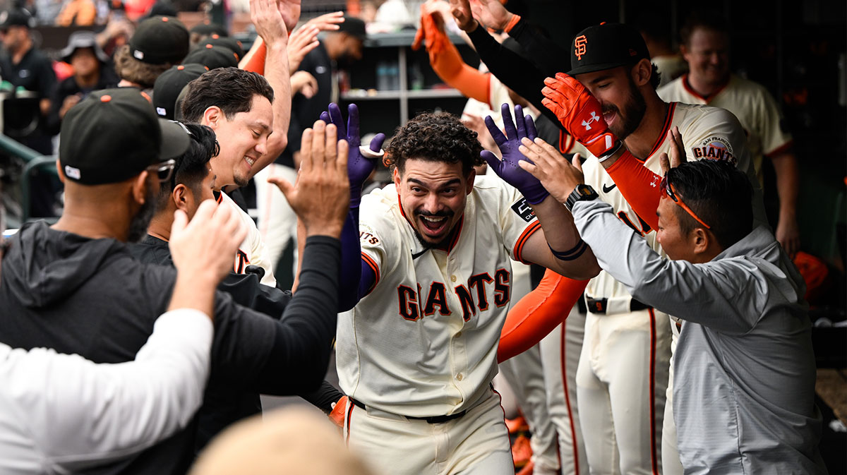San Francisco Giants shortstop Willy Adames (2) celebrates in the dugout after his solo home run against the Colorado Rockies in the first inning at Oracle Park.