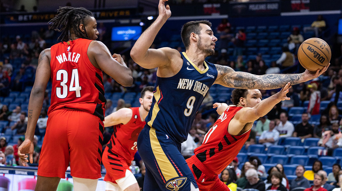 New Orleans Pelicans center Willy Hernangomez (9) grabs a rebound from Portland Trail Blazers forward Kevin Knox II (11) during the second half at Smoothie King Center.