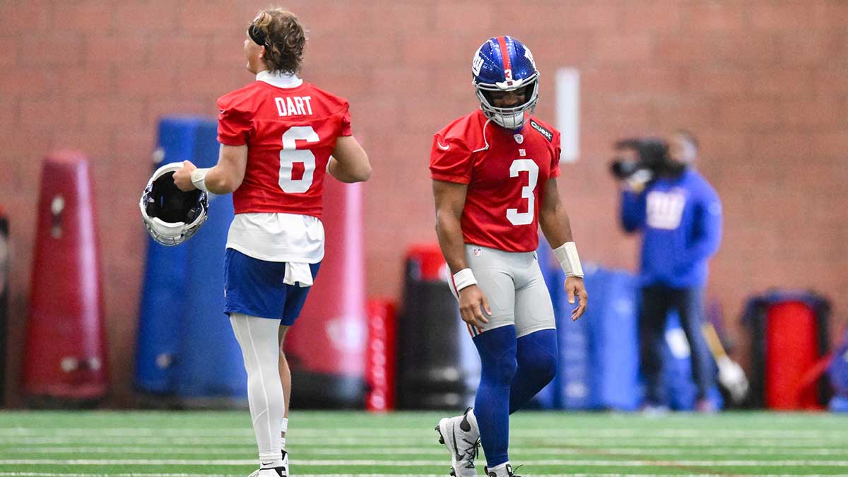 New York Giants quarterback Jaxson Dart (6) and quarterback Russell Wilson (3) interact during minicamp at Quest Diagnostics Training Center.