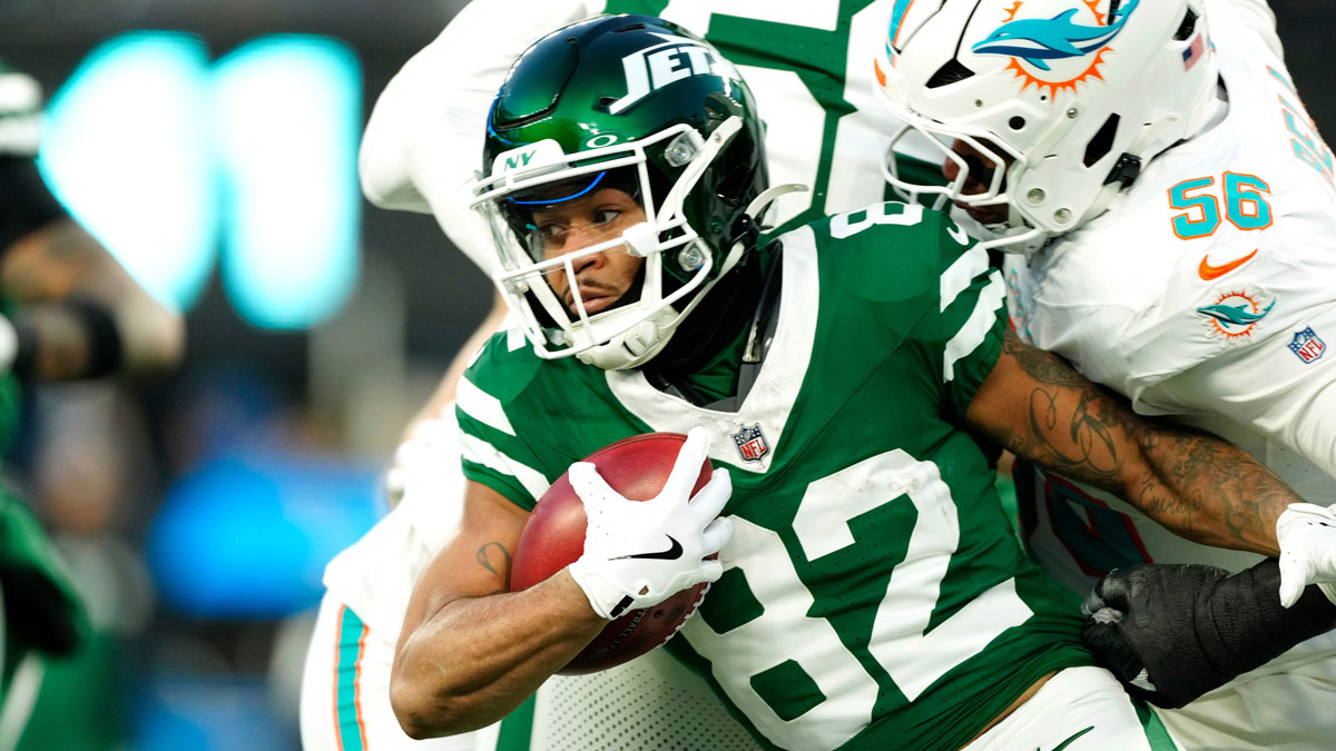 New York Jets wide receiver Xavier Gipson (82) tries to break the tackle of Miami Dolphins linebacker Quinton Bell (56), Sunday January 5, 2025, in East Rutherford.
