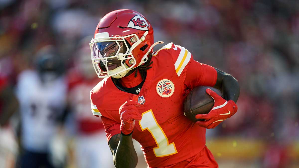 Kansas City Chiefs wide receiver Xavier Worthy (1) runs with the ball during the second half against the Denver Broncos at GEHA Field at Arrowhead Stadium.