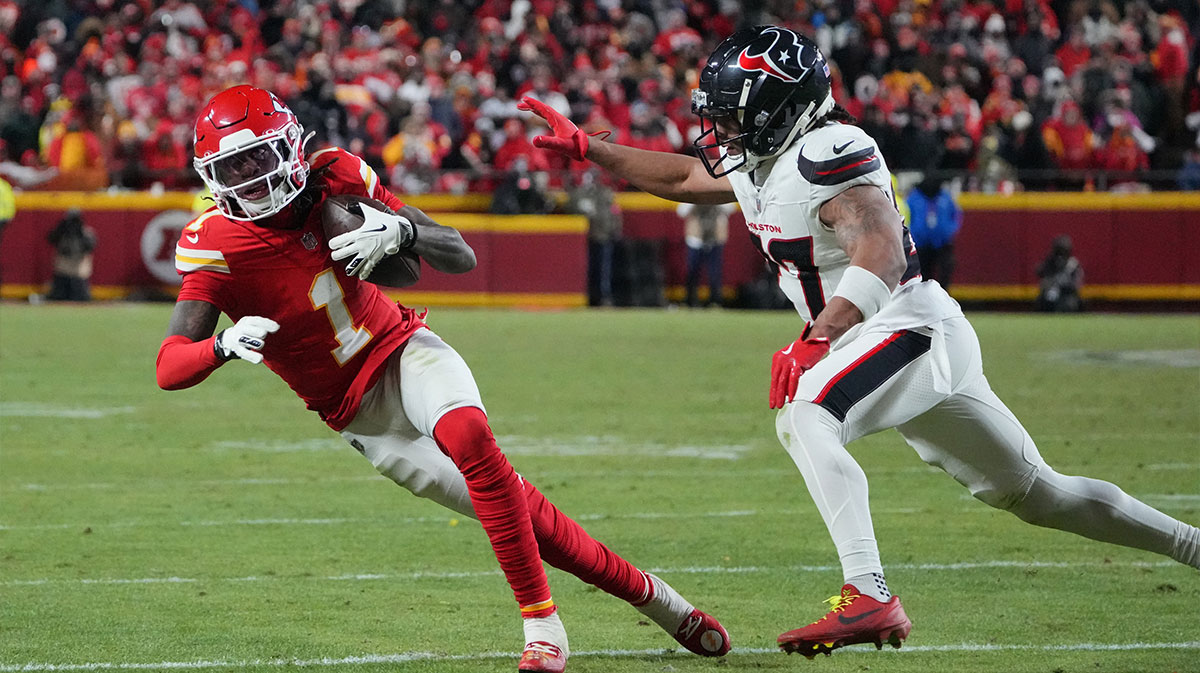 Kansas City Chiefs wide receiver Xavier Worthy (1) runs the ball against Houston Texans cornerback Myles Bryant (27) during the fourth quarter of a 2025 AFC divisional round game at GEHA Field at Arrowhead Stadium.
